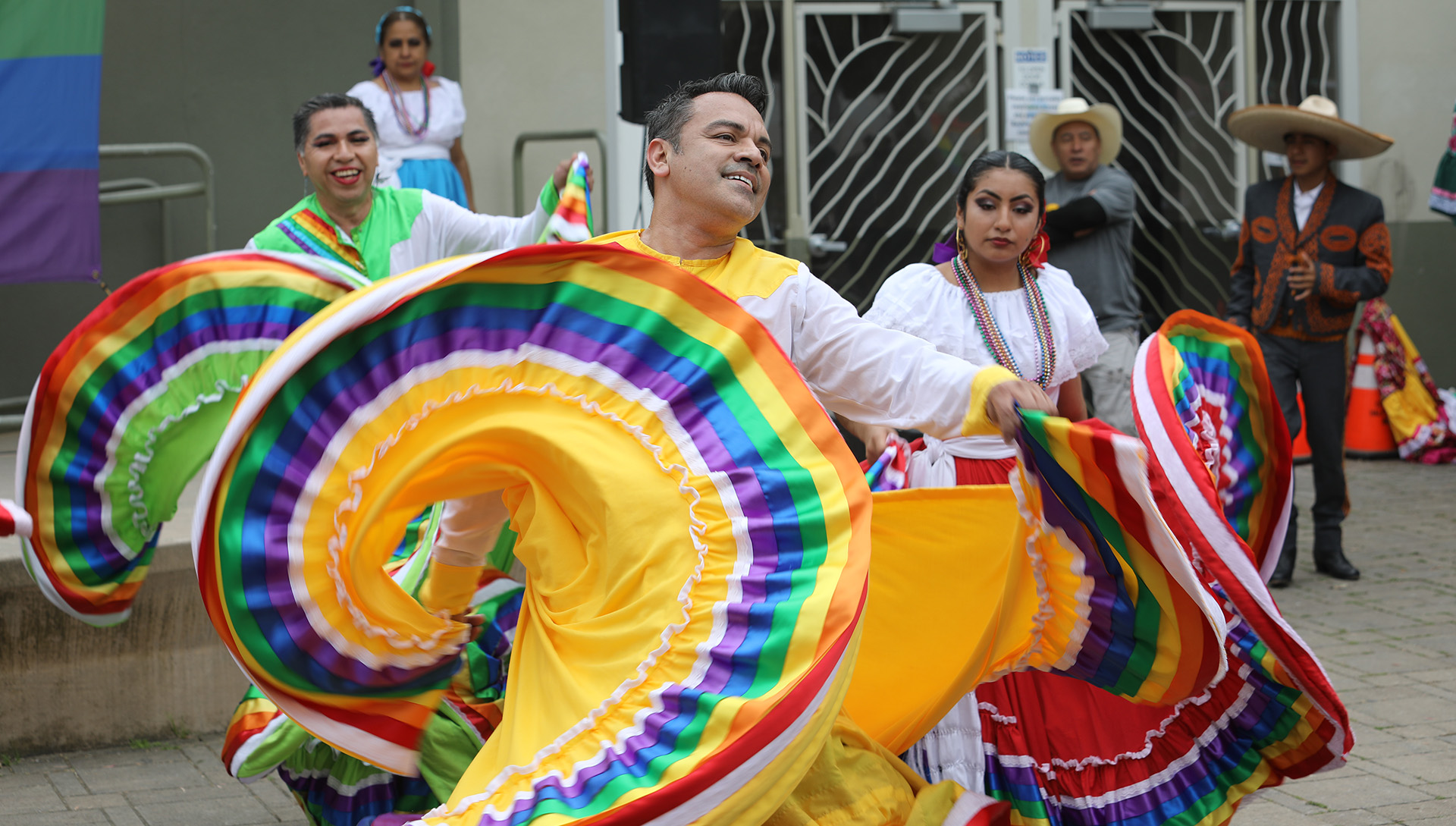 dancers from ensemble folcl&oacute;rico colibri flouncing their multi-colored circle skirts